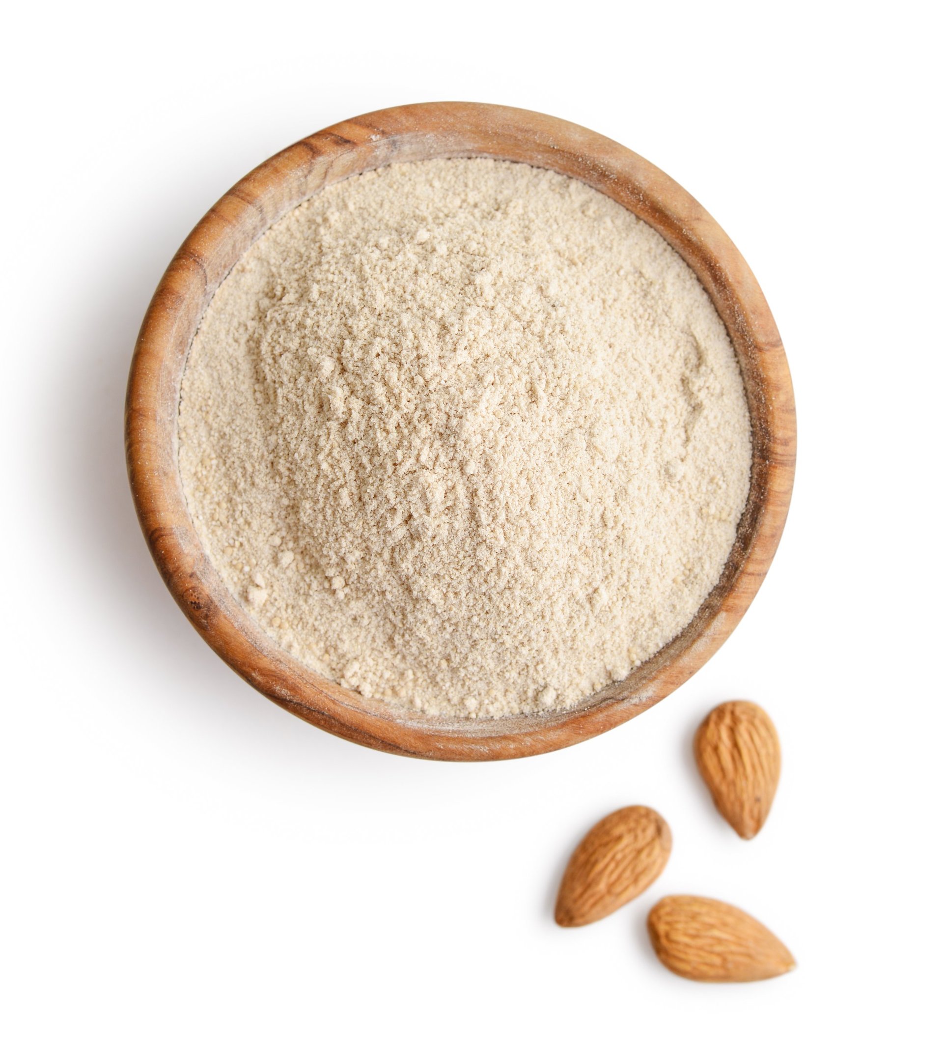 Almond flour in wooden bowl isolated on white background, top view